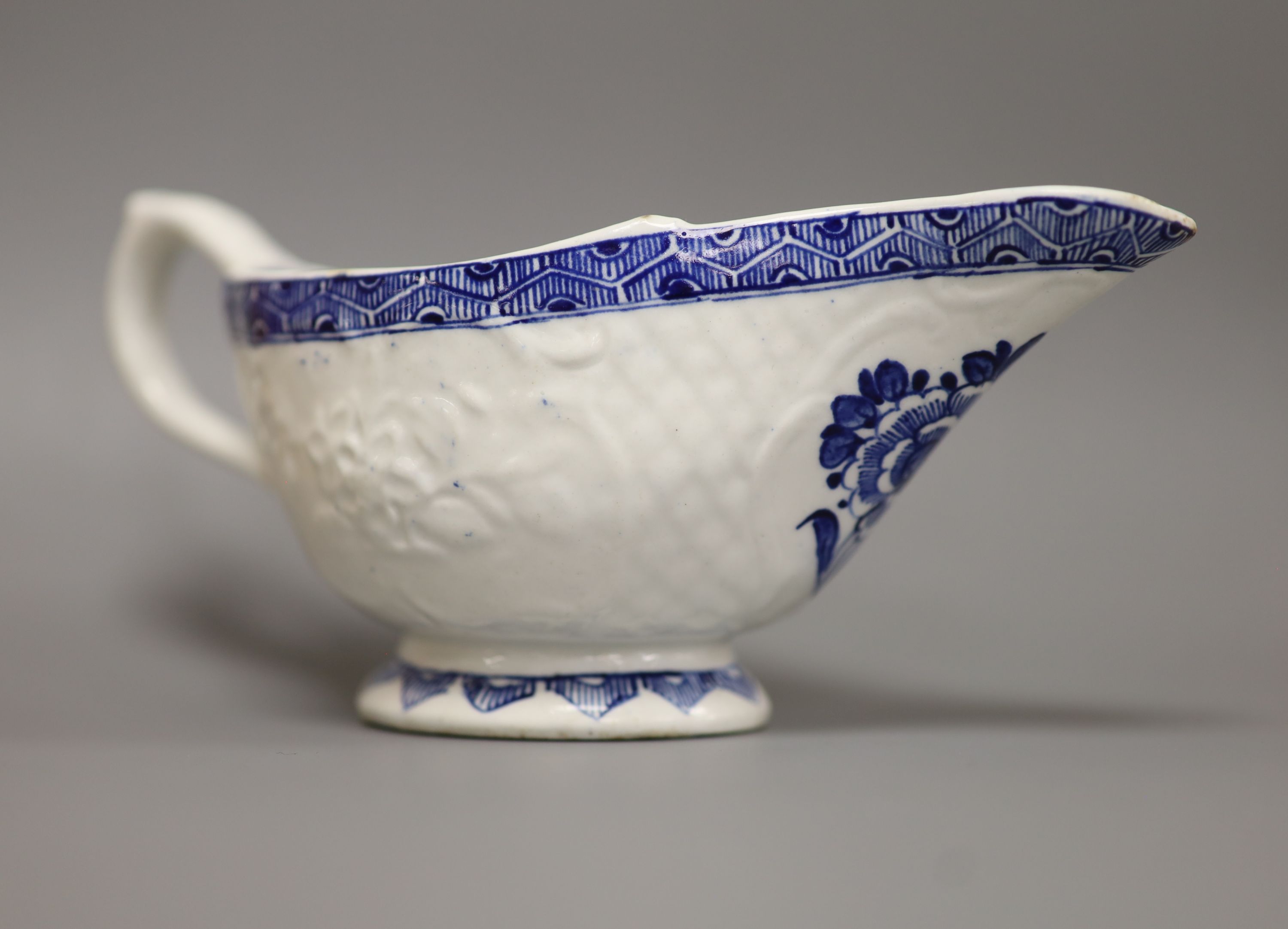 A Derby sauceboat, with flowers, c.1765, patch marks, length 17cm